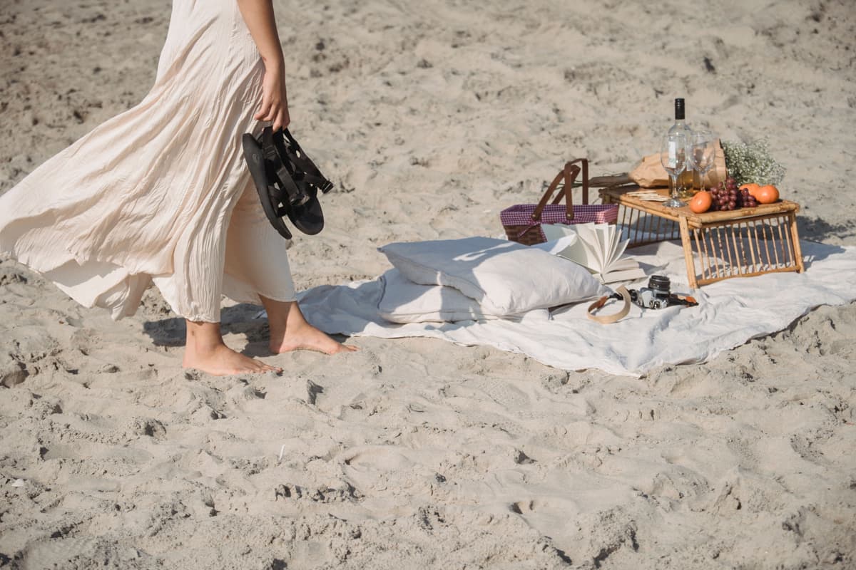 A blanket spread out on beach sand