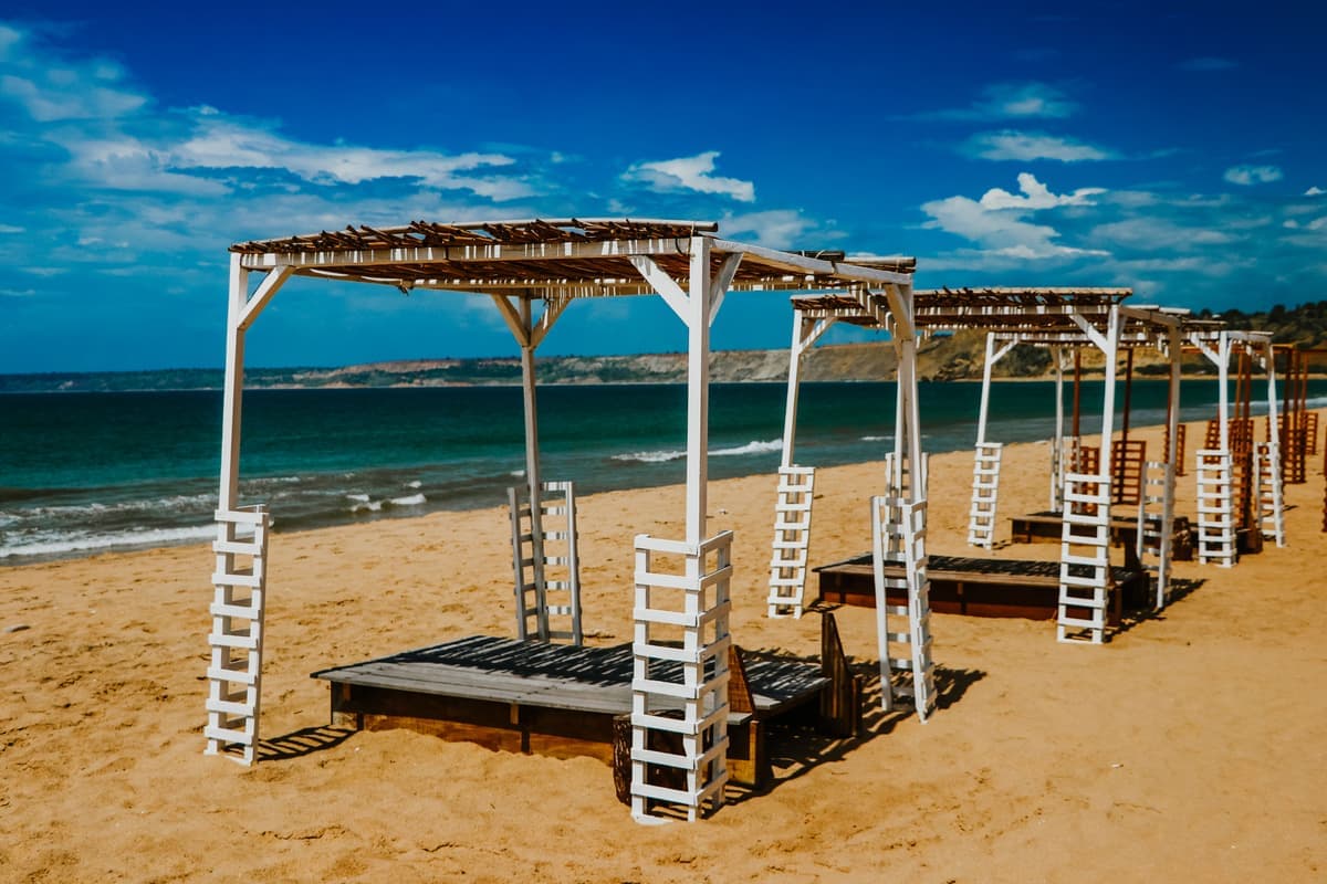A beach canopy stretched over sand
