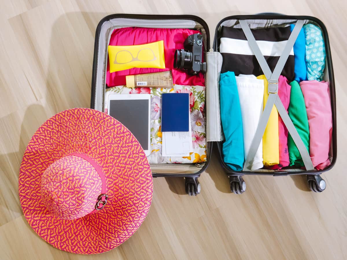 A suitcase packed for a beach holiday